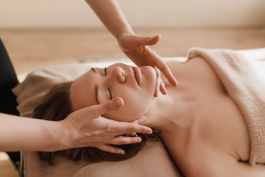 Woman receiving a facial at the spa.