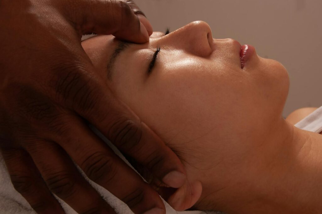 Woman getting a facial spa treatment.
