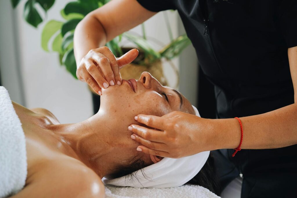 Woman getting facial spa treatment.