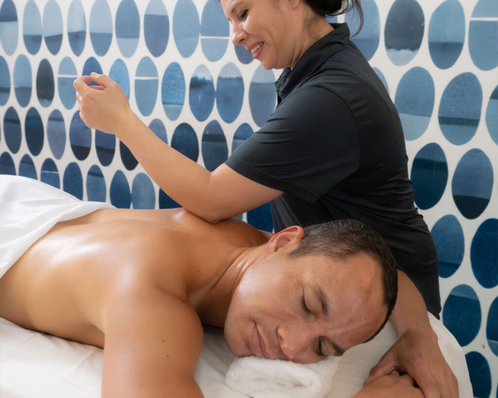 Man receiving a deep tissue massage.