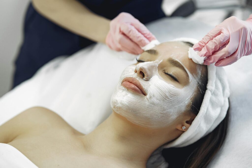 Woman getting facial spa treatment.